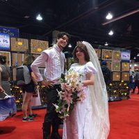 Couple dressed up like Rapunzel and Flynn in the D23