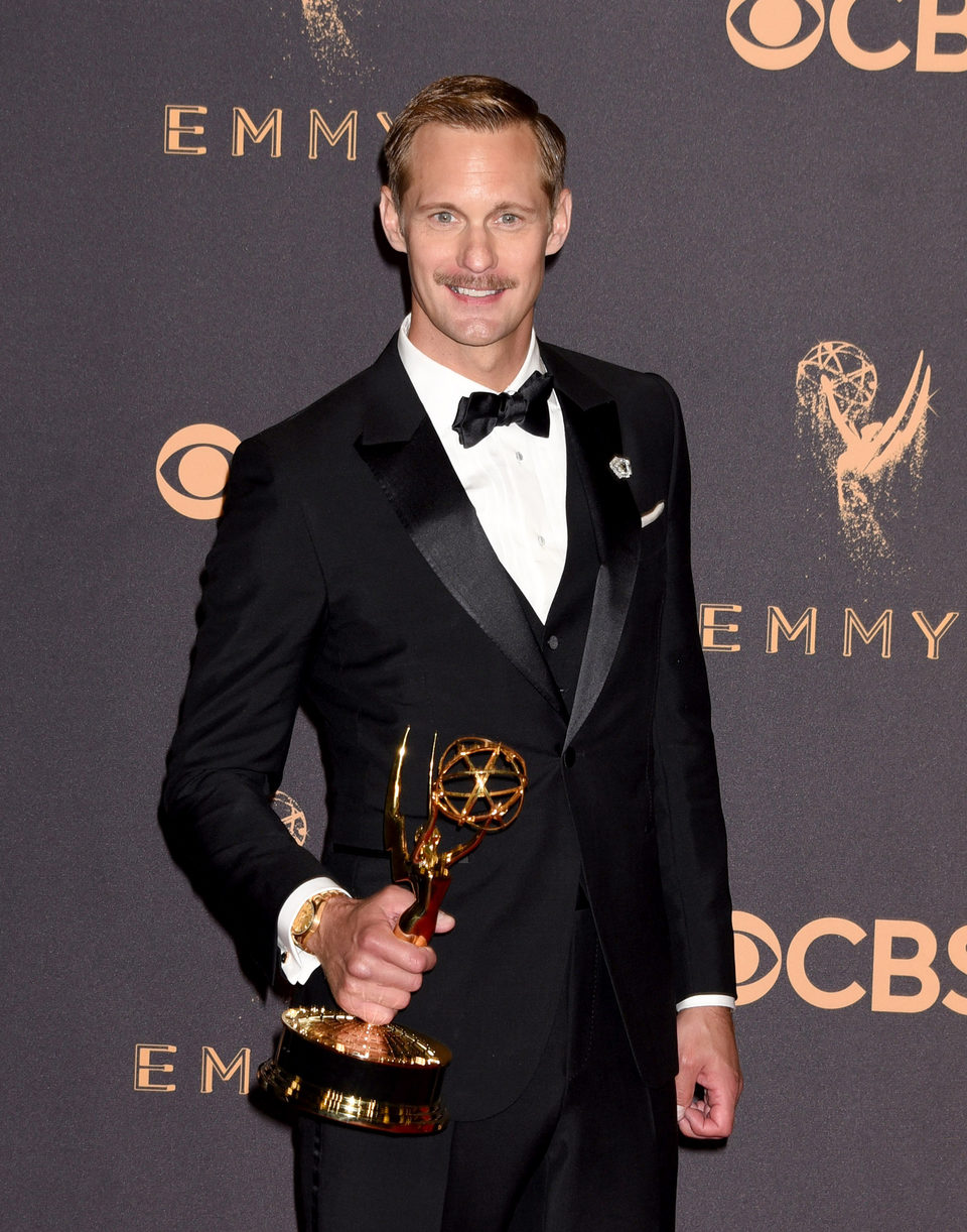 Alexander Skarsgard with his Emmy 2017 for best supporting actor in a miniseries