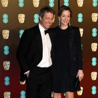 Hugh Grant and Anna Eberstein at the BAFTA Awards' 2018 red carpet