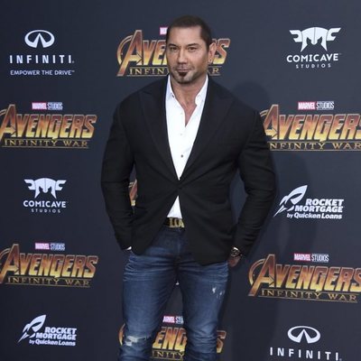 Dave Bautista poses on the purple carpet for the world premiere of 'Avengers: Infinity War'