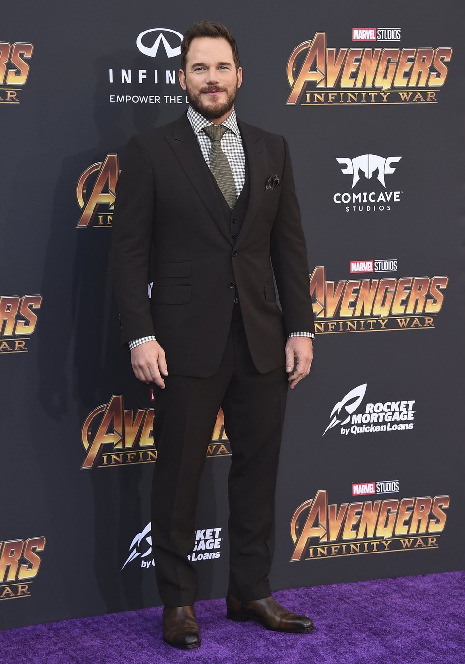 Chris Pratt poses on the purple carpet at the world premiere of 'Avengers: Infinity War'