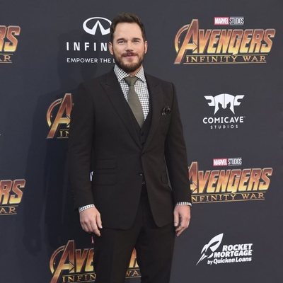 Chris Pratt poses on the purple carpet at the world premiere of 'Avengers: Infinity War'