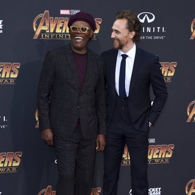 Samuel L. Jackson and Tom Hiddleston pose together on the purple carpet at the world premiere of 'Avengers: Infinity War'