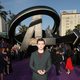 Tom Holland poses on the purple carpet at the world premiere of 'Avengers: Infinity War'