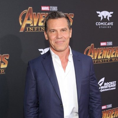 Josh Brolin poses on the purple carpet at the world premiere of 'Avengers: Infinity War'