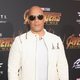 Vin Diesel poses on the purple carpet at the world premiere of 'Avengers: Infinity War'