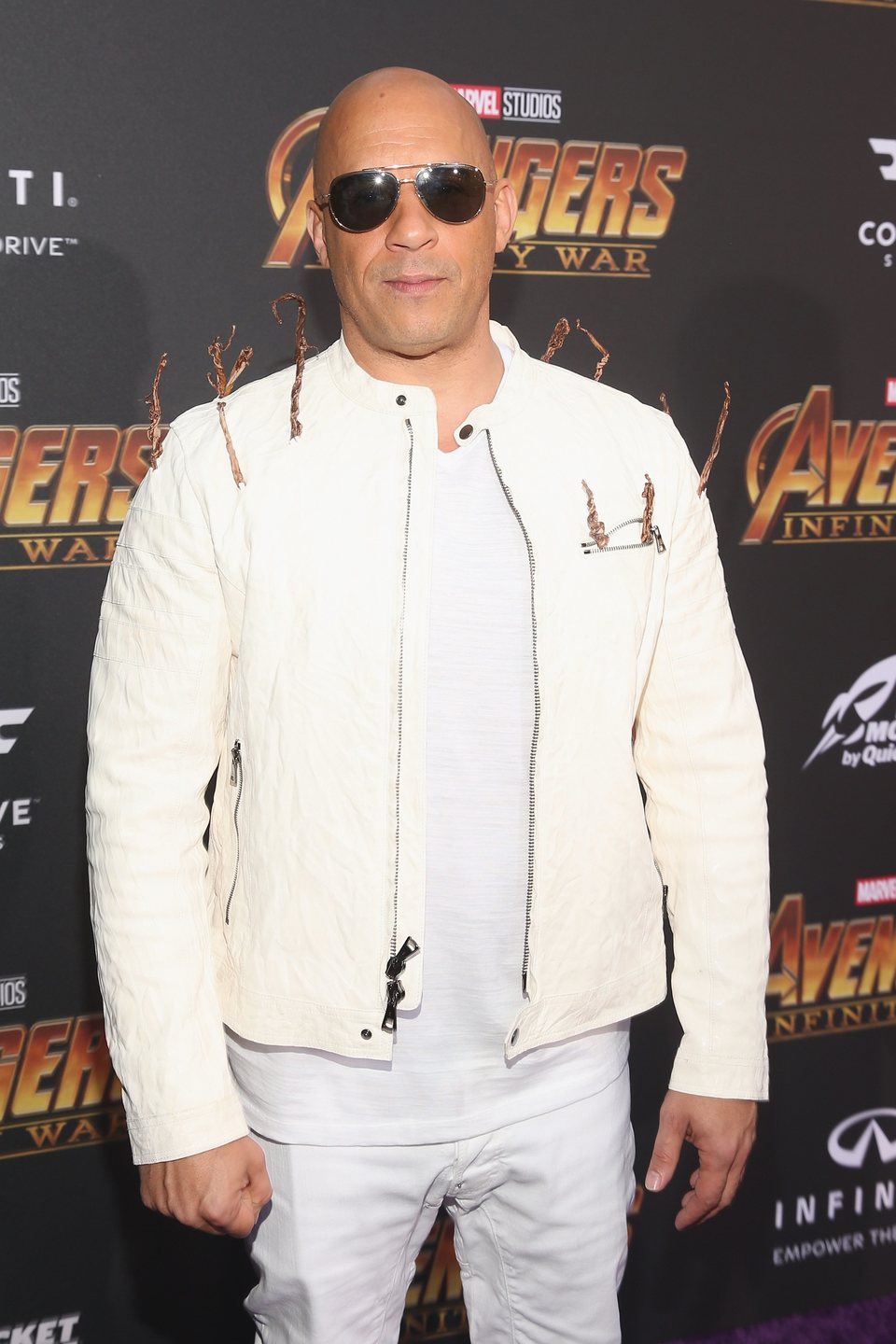 Vin Diesel poses on the purple carpet at the world premiere of 'Avengers: Infinity War'