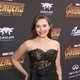 Elizabeth Olsen poses on the purple carpet at the world premiere of 'Avengers: Infinity War' 