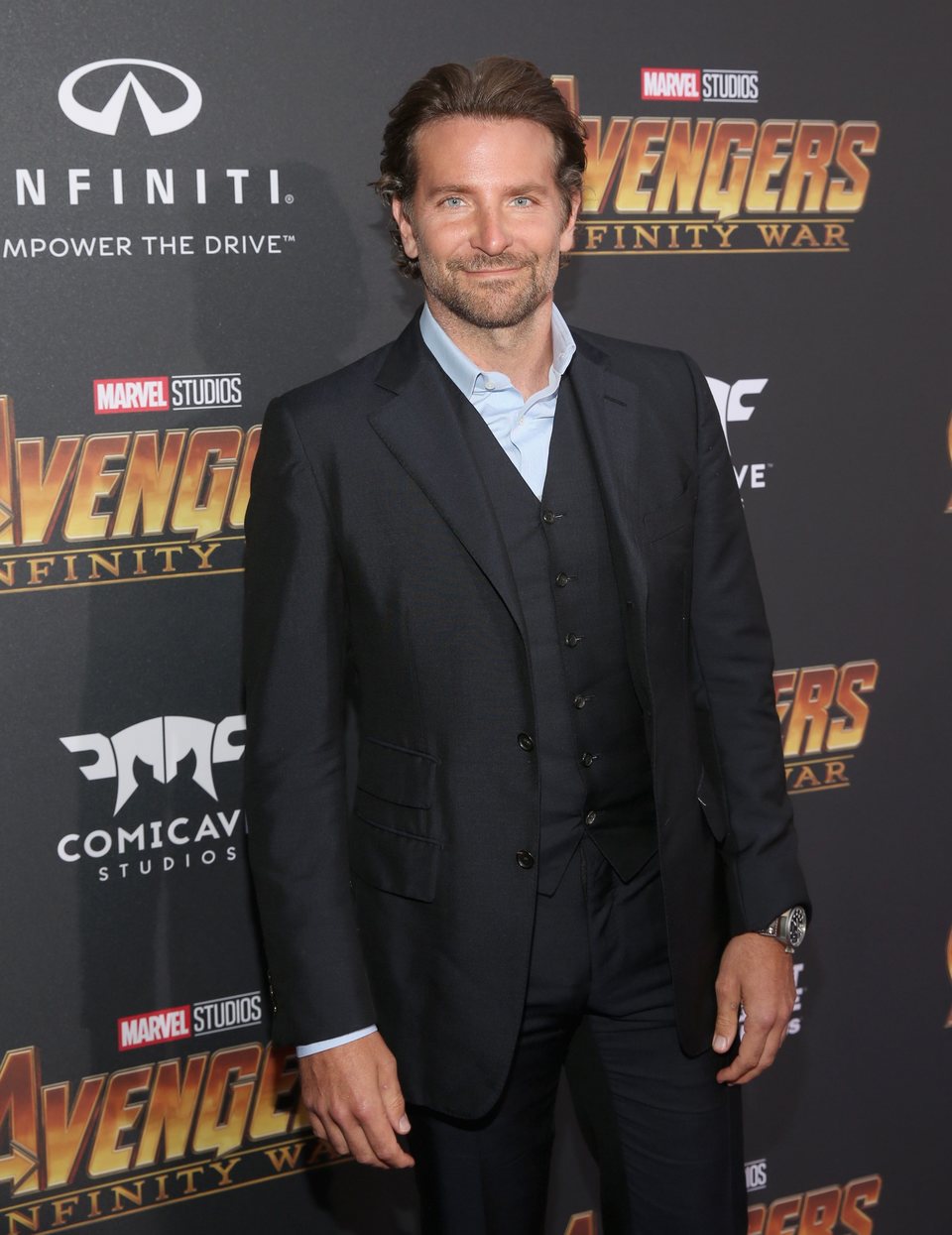 Bradley Cooper poses on the purple carpet at the world premiere for 'Avengers: Infinity War'