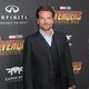 Bradley Cooper poses on the purple carpet at the world premiere for 'Avengers: Infinity War'