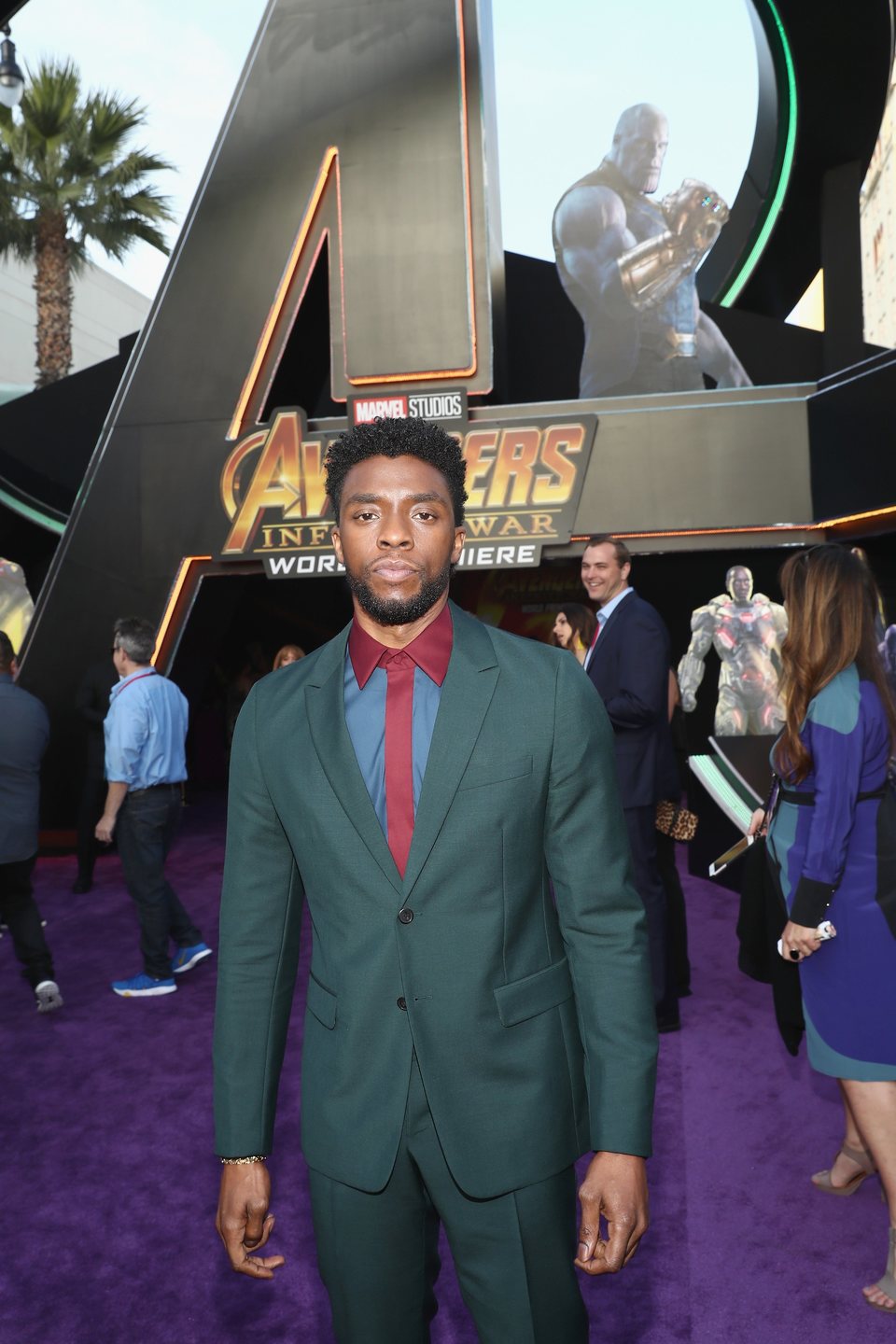 Chadwick Boseman poses on the purple carpet at the world premiere of 'Avengers: Infinity War'