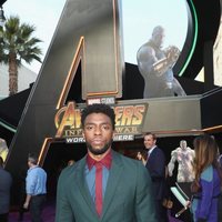 Chadwick Boseman poses on the purple carpet at the world premiere of 'Avengers: Infinity War'