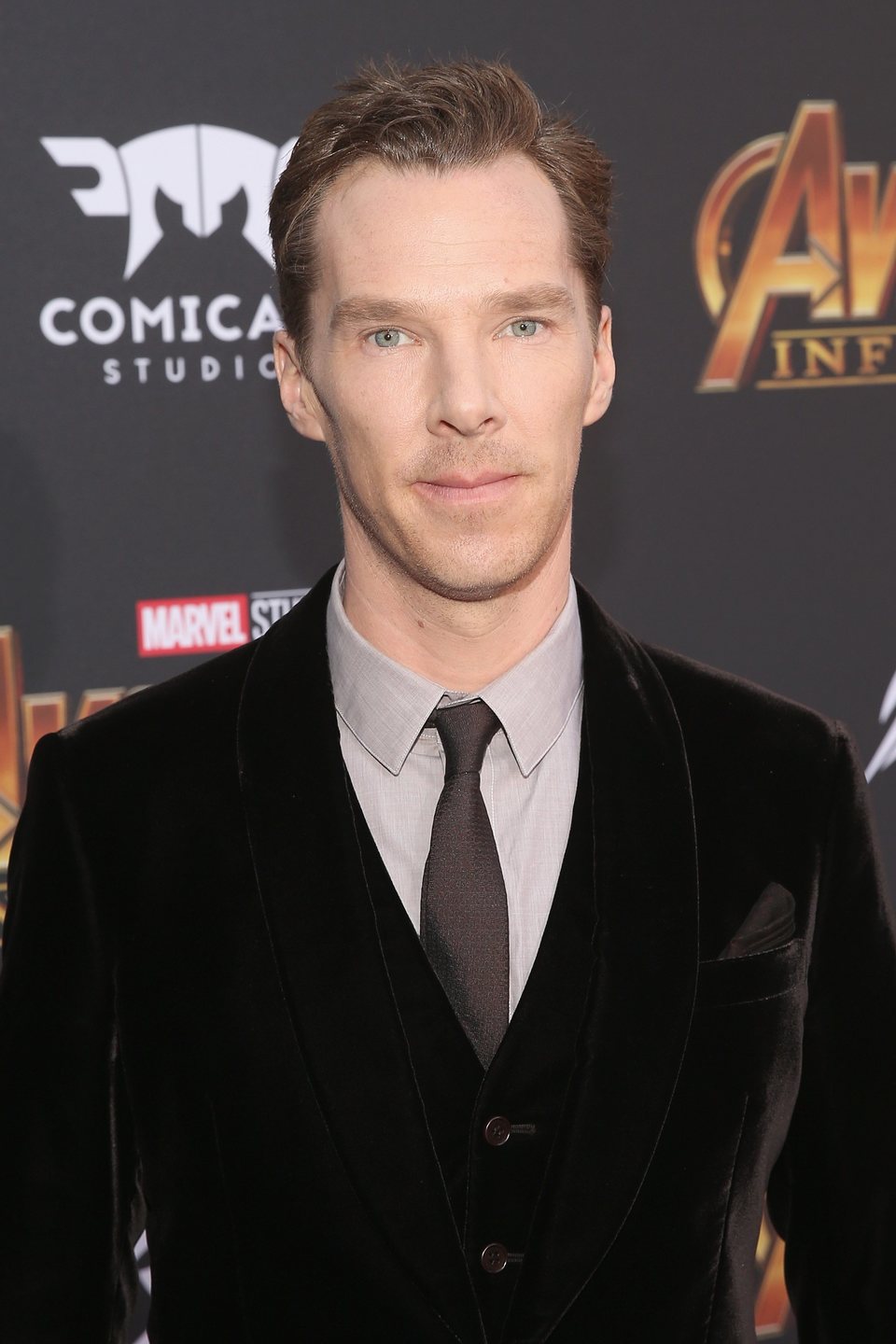 Benedict Cumberbatch poses on the purple carpet at the world premiere of 'Avengers: Infinity War'