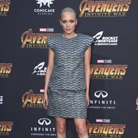 Pom Klemmentieff poses on the purple carpet at the world premiere of 'Avengers: Infinity War'