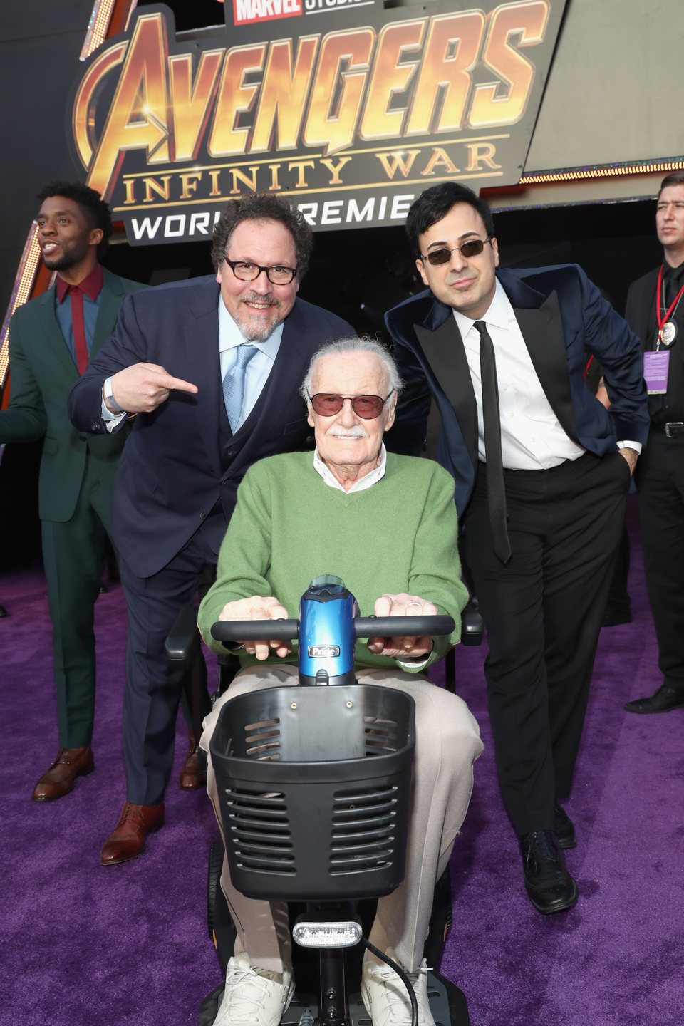 Stan Lee & Jon Favreau pose on the purple carpet at the world premiere of 'Avengers: Infinity War'