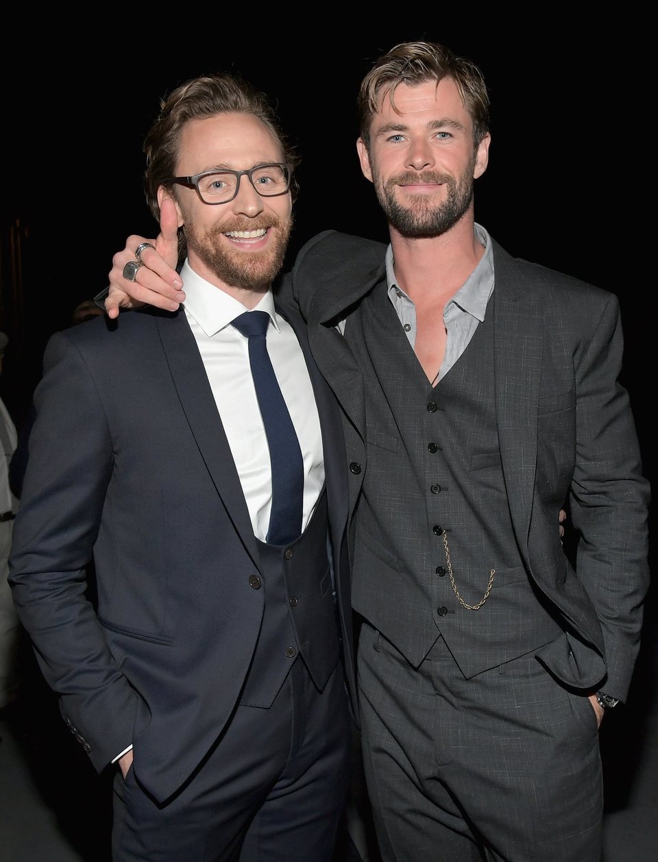 Chris Hemsworth & Tom Hiddleston pose on the purple carpet at the world premiere of 'Avengers: Infinity War'