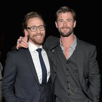 Chris Hemsworth & Tom Hiddleston pose on the purple carpet at the world premiere of 'Avengers: Infinity War'