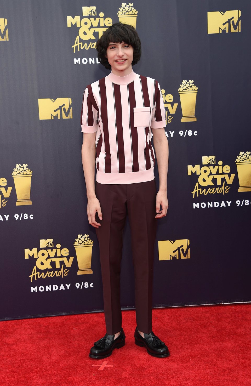 Finn Wolfhard at the MTV Movie & TV Awards 2018 red carpet