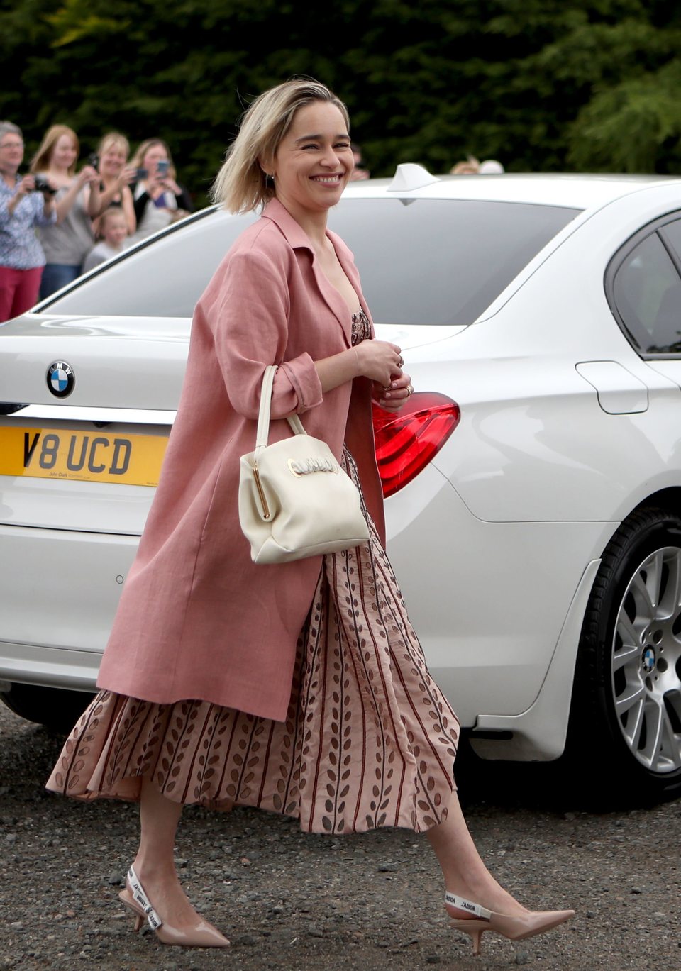 Emilia Clarke arrives at the wedding of Kit Harington and Rose Leslie