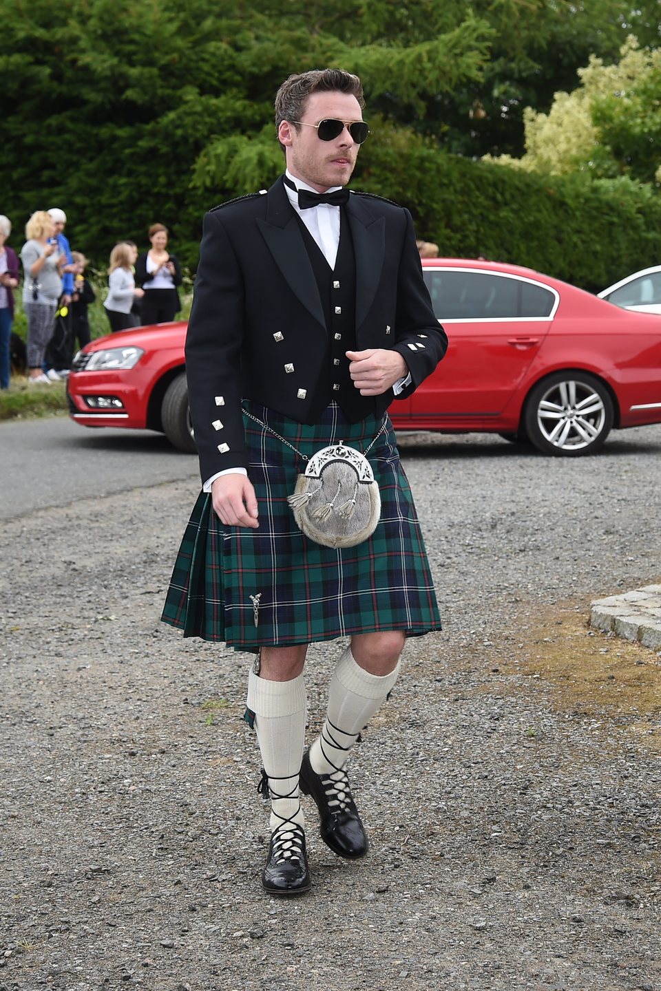 Richard Madden arrives at the wedding of Kit Harington and Rose Leslie