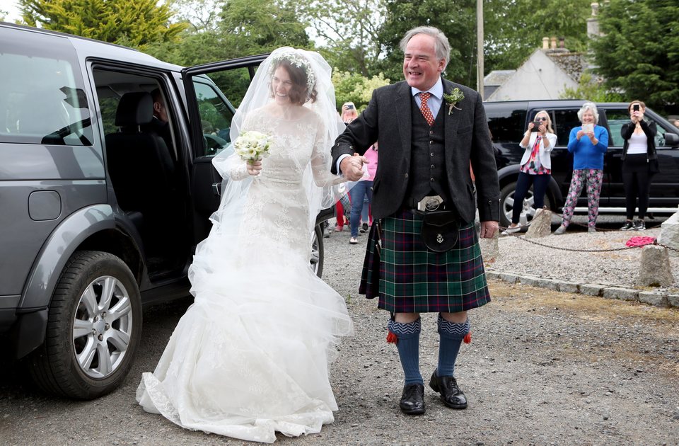 Rose Leslie and her father arrive at the ceremony